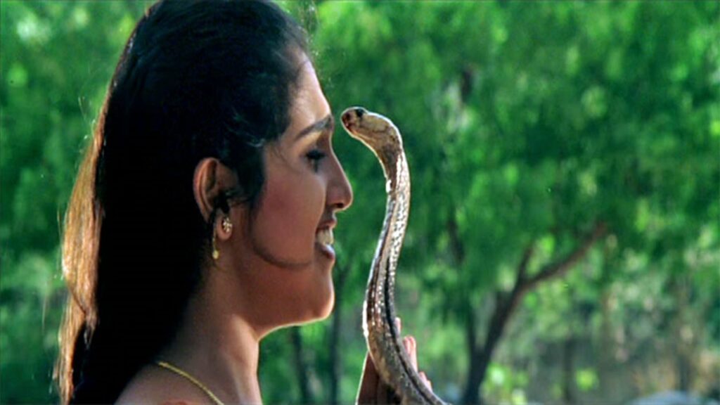 Did the snake in the Devi Movie take the life of the boy